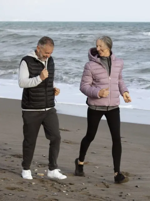 Ankle & Foot Centers of America — couple walking on the beach